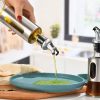"روغن پاش شیشه ای با روکش استیل 300 میلی لیتری ضدچکه و شیک برای نگهداری و استفاده از روغن در آشپزخانه"